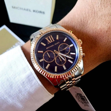Michael Kors MK8412 men's two-tone watch with blue dial worn on wrist