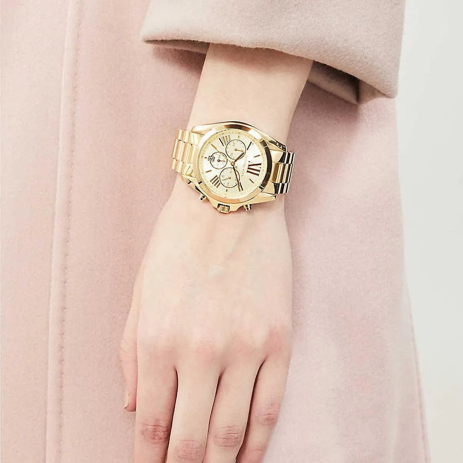 Front view of Michael Kors MK5605 women's gold-tone watch with monochromatic dial