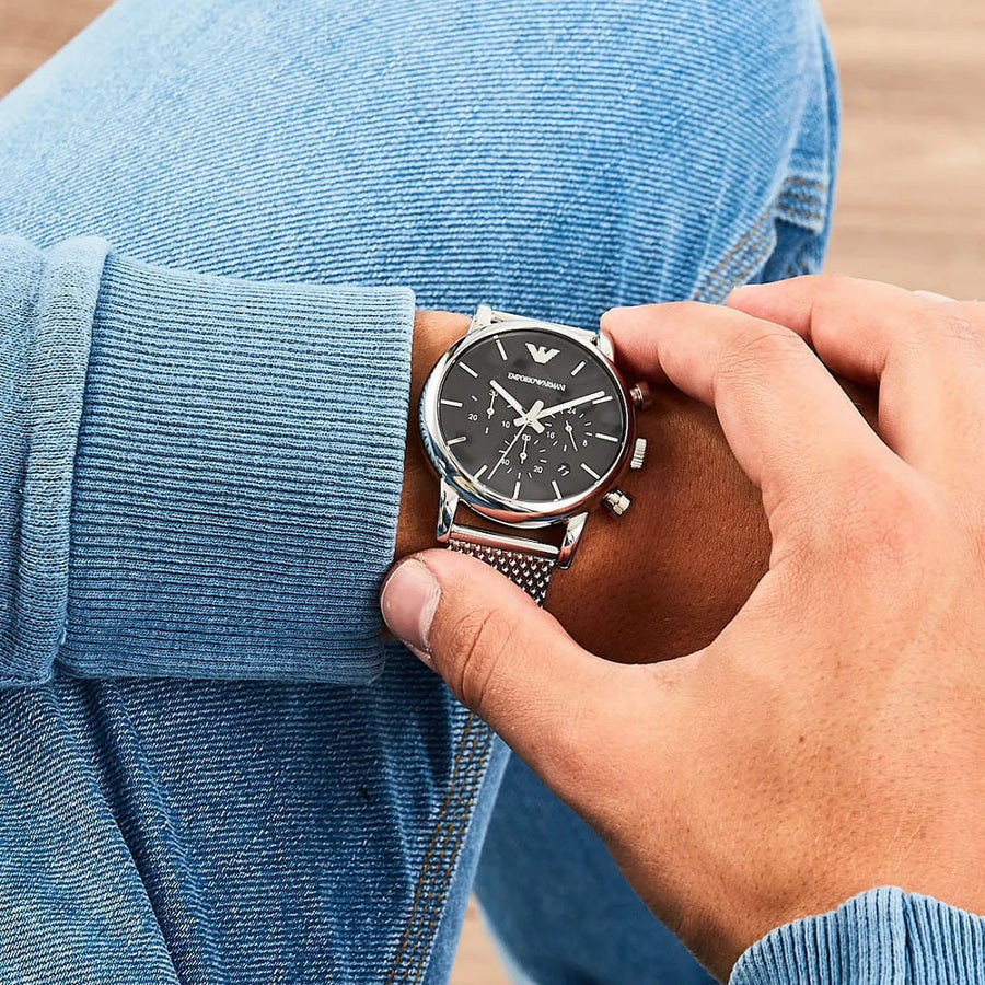 Front view of Emporio Armani AR1811 with silver mesh band and bold black dial