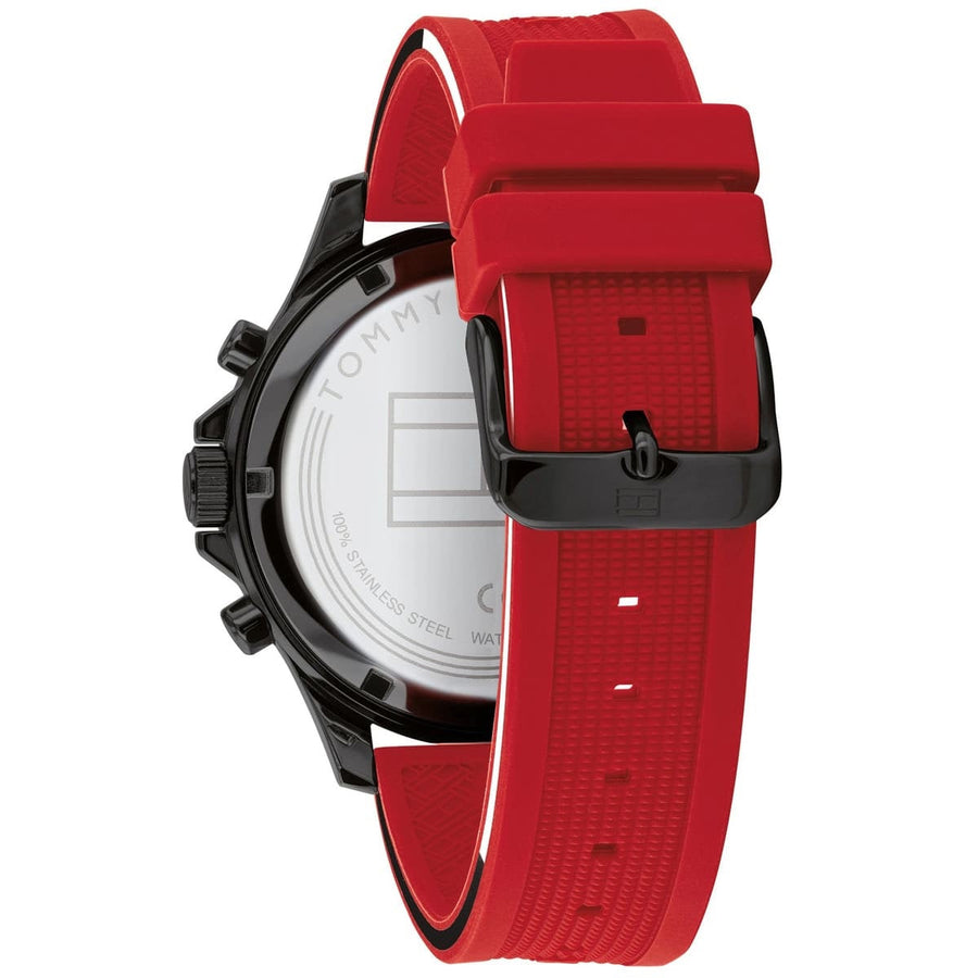 Close-up of Tommy Hilfiger 1791722 men’s watch featuring black dial, red silicone strap, and black case