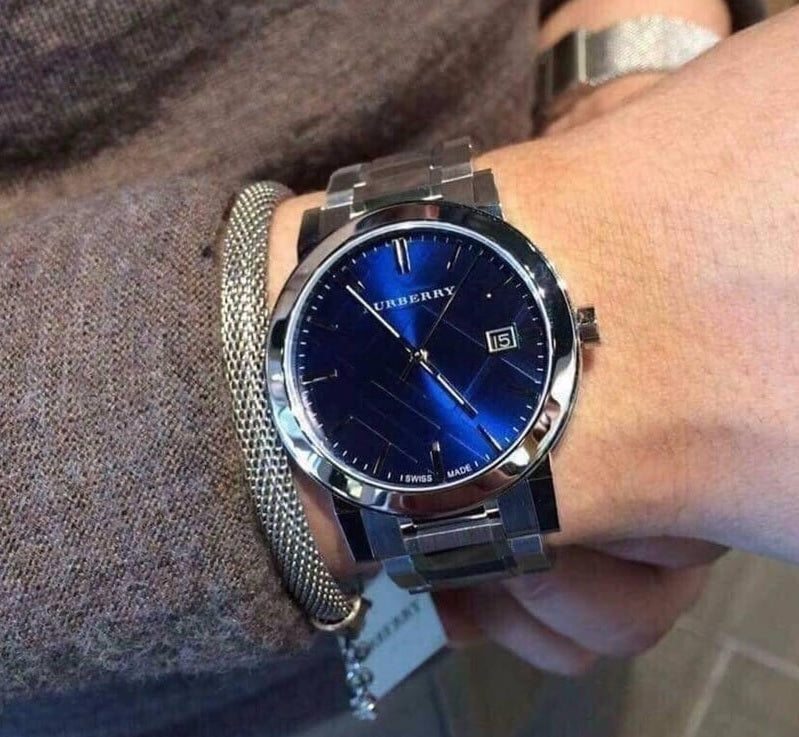 Front view of Burberry BU9031 The City watch with silver strap and blue dial