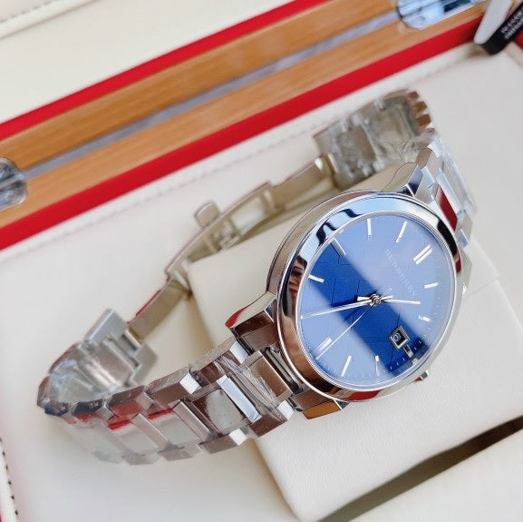 Front view of Burberry BU9031 The City watch with silver strap and blue dial