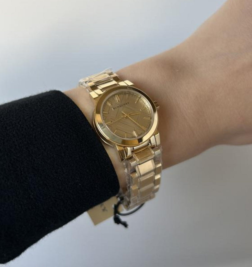 Front view of Burberry BU9227 The City women’s watch with stainless steel gold strap and gold dial