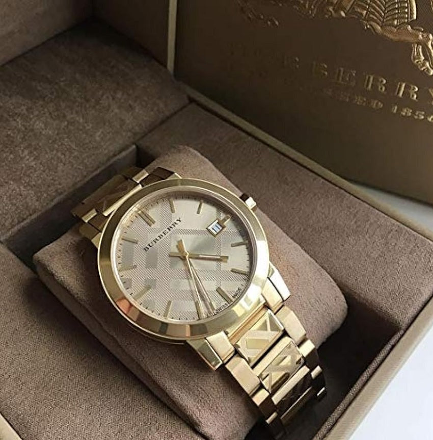 Front view of Burberry BU9038 unisex gold stainless steel watch with matching gold dial
