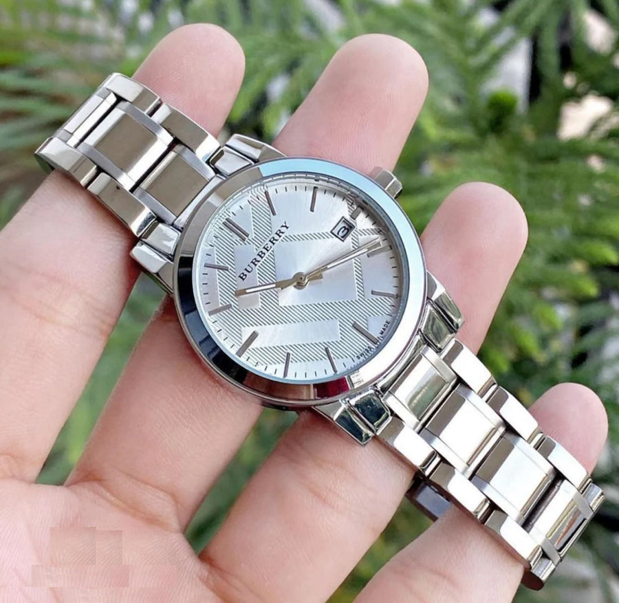 Elegant front view of Burberry BU9100 The City women’s watch with silver stainless steel strap and dial
