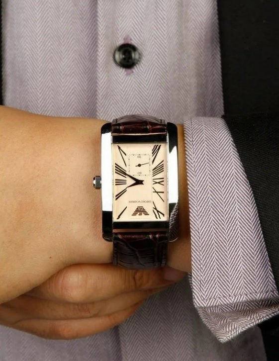 Front view of Emporio Armani AR0154 men’s watch with brown leather strap, beige dial, and silver case