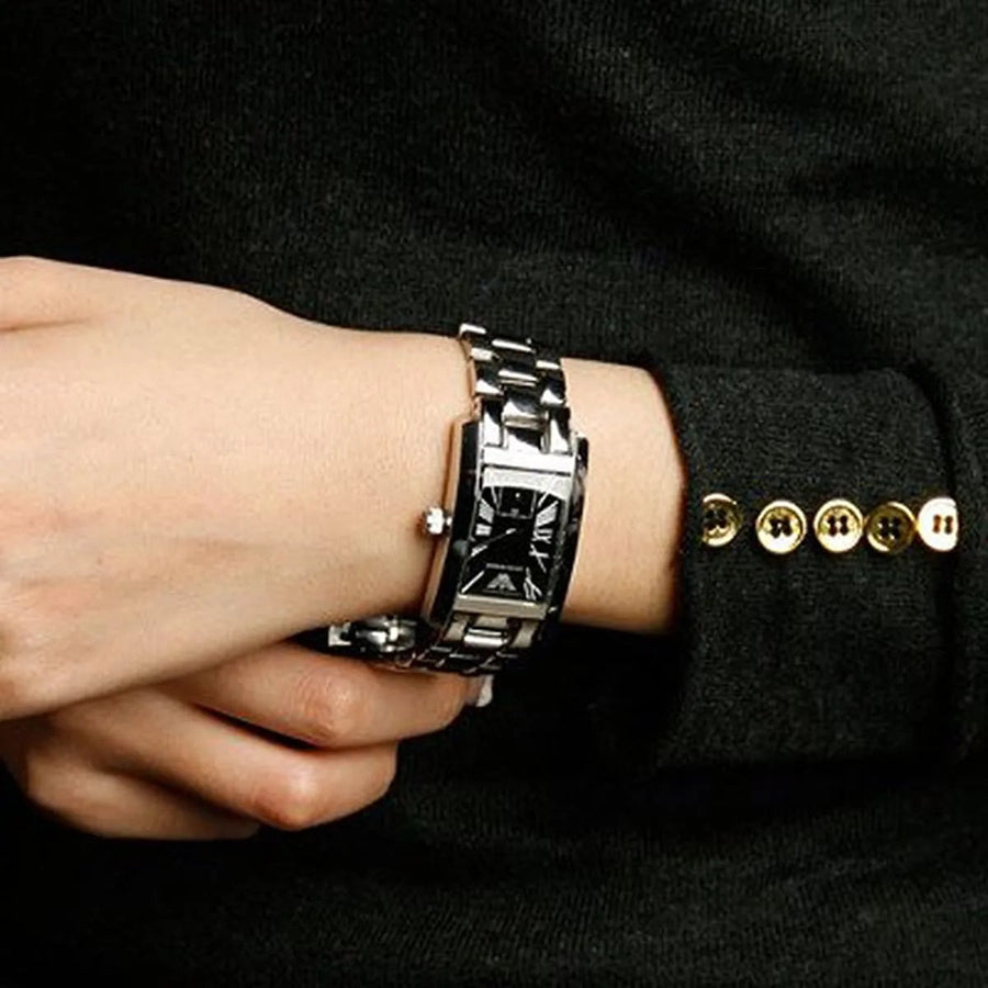 Front view of Emporio Armani AR0157 women's watch with stainless steel silver strap and black dial