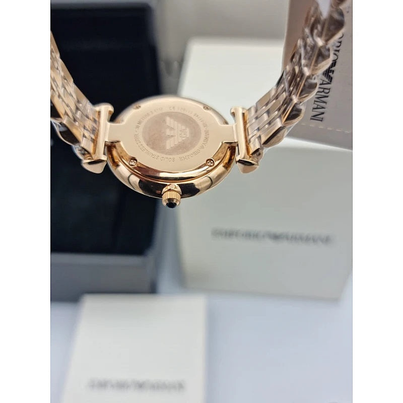 Front view of Emporio Armani AR11145 Gianni T-Bar women’s watch with black dial and rose gold strap