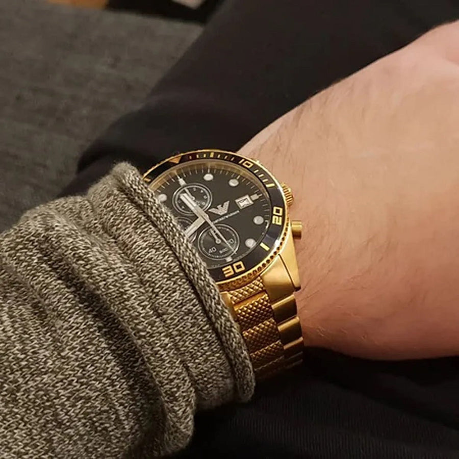 Front view of Emporio Armani AR5857 men’s watch with yellow gold strap and black dial