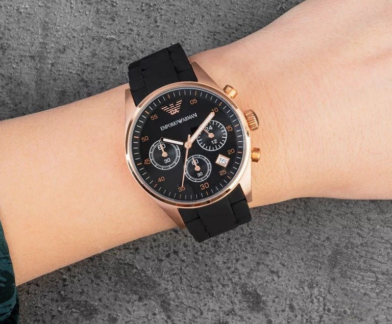 Front view of Emporio Armani AR5906 Sportivo women’s watch with black silicone strap and rose gold case