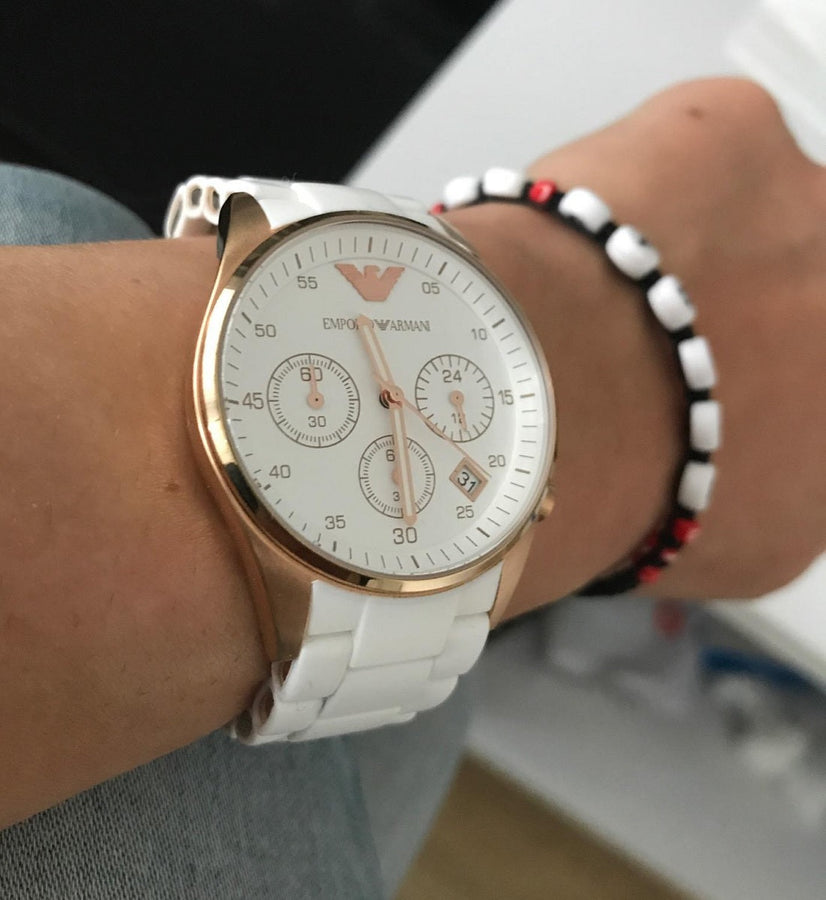 Front view of Emporio Armani AR5920 Sportivo women’s watch with white silicone strap and rose gold case