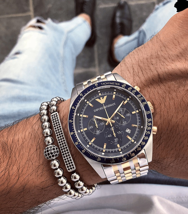 Front view of Emporio Armani AR8030 Tazio men’s watch with blue dial and two-tone silver and gold-tone strap