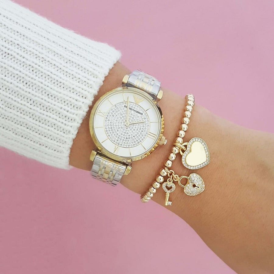 Front view of Emporio Armani AR8031 Gianni T-Bar women’s watch with white pave crystal dial and two-tone strap