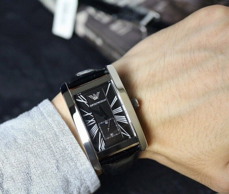 Close-up of Emporio Armani AR0143 leather strap and black dial details