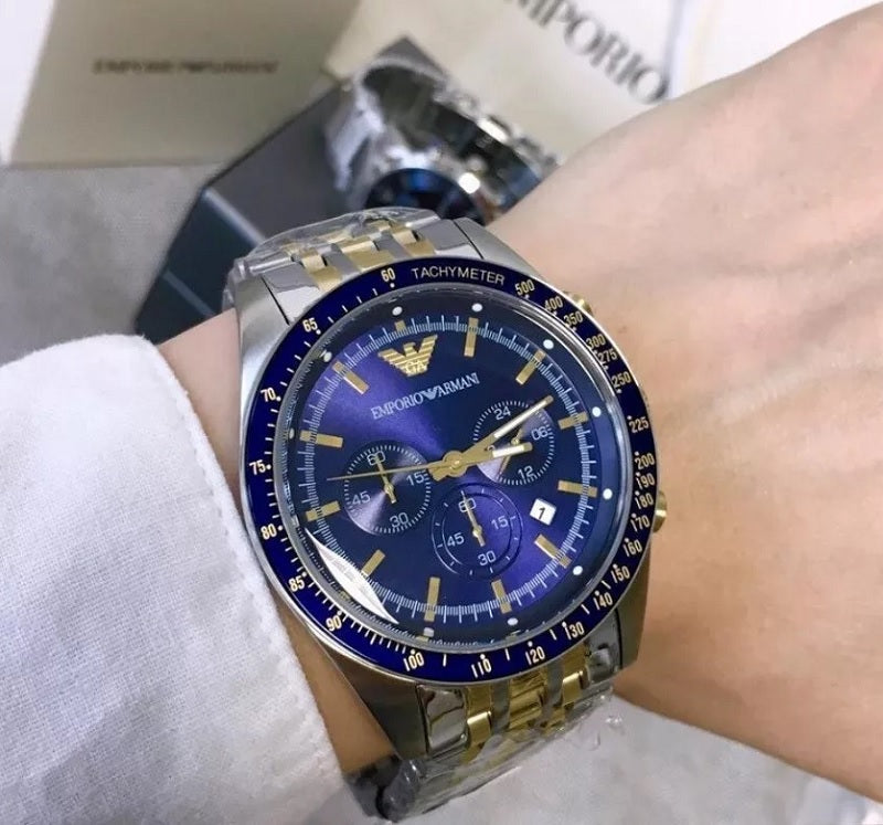 Front view of Emporio Armani AR6088 Tazio men’s watch with navy blue dial and two-tone silver and gold-tone strap