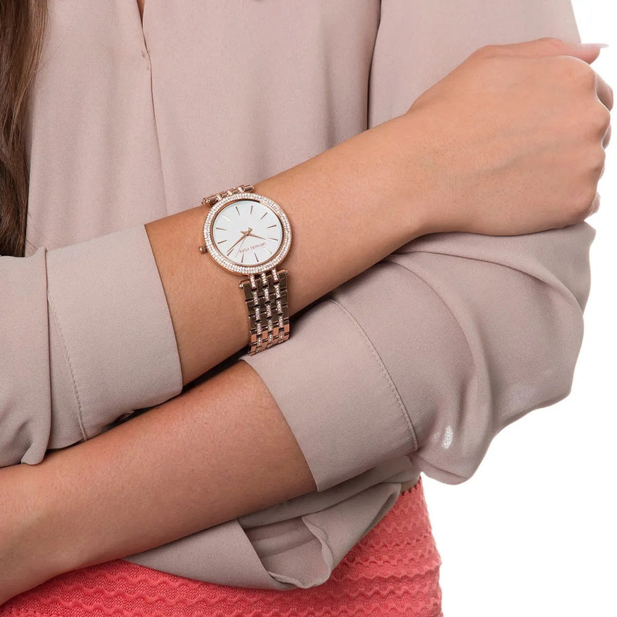 Close-up of Michael Kors MK3220 mother of pearl dial, featuring crystal accents and signature MK branding