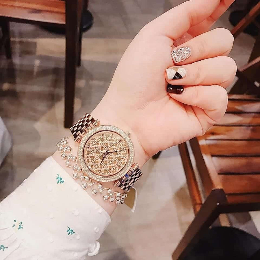 Front view of Michael Kors MK3399 showcasing rose gold crystal dial and matching strap