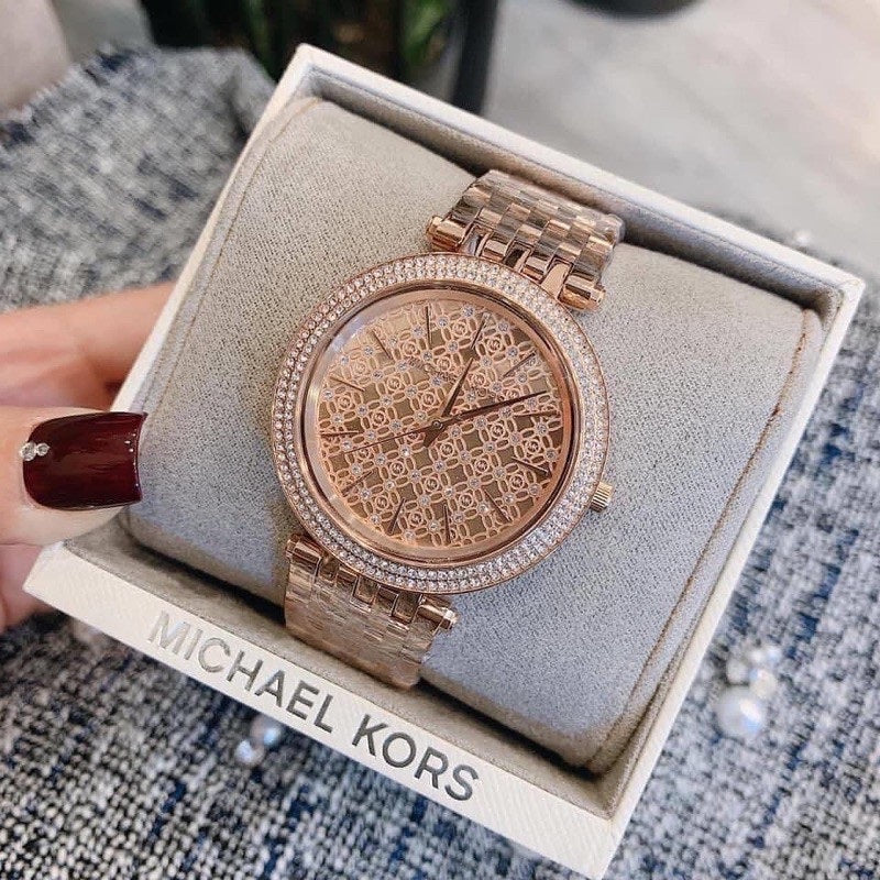 Front view of Michael Kors MK3399 showcasing rose gold crystal dial and matching strap