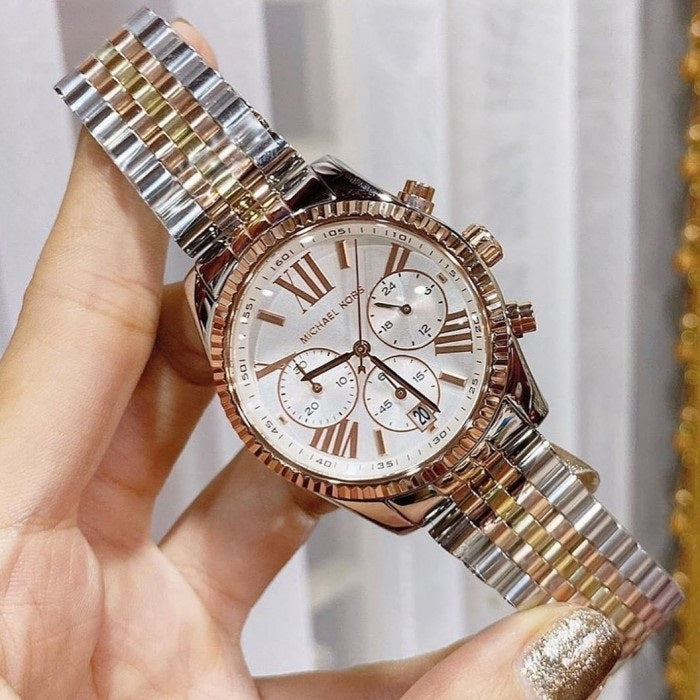 Front view of Michael Kors MK5735 showing silver dial and polished two-tone bracelet