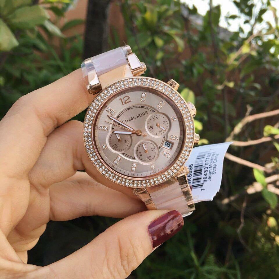 Front view of Michael Kors MK5896 women's rose gold watch with seamless dial