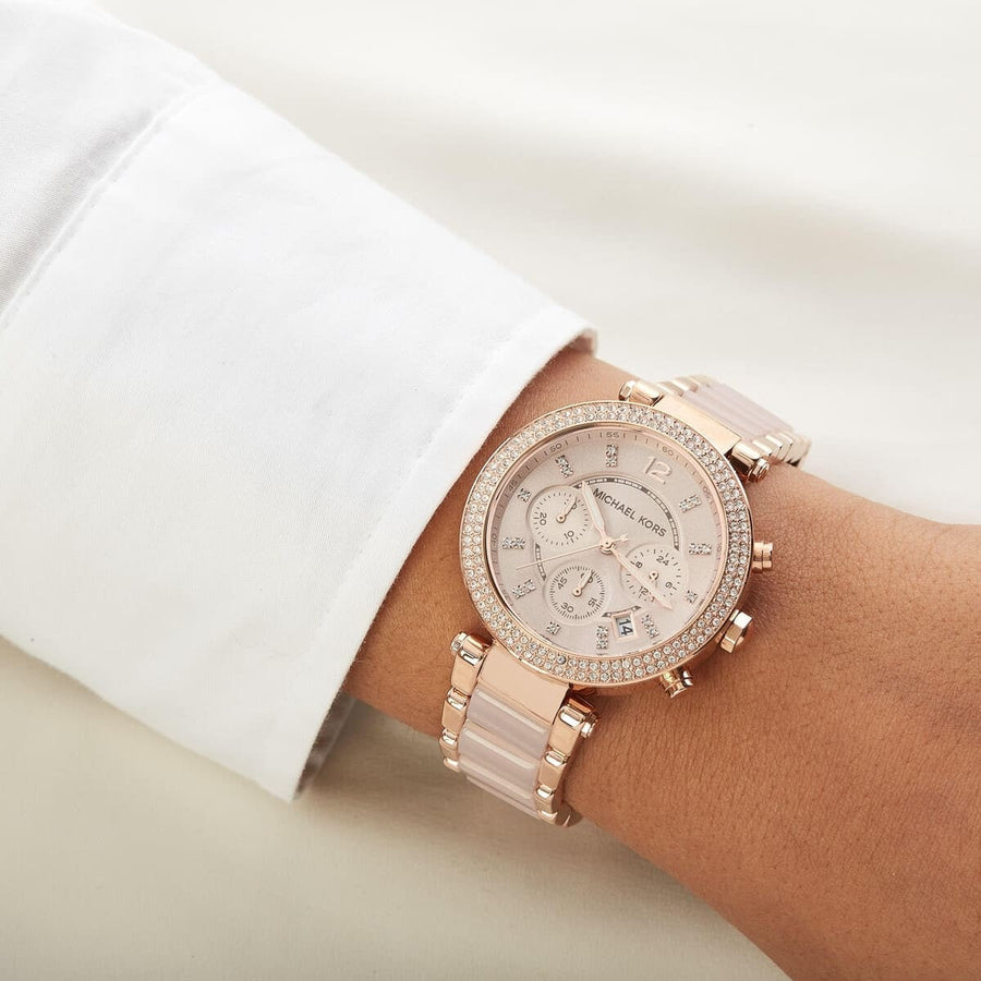 Front view of Michael Kors MK5896 women's rose gold watch with seamless dial