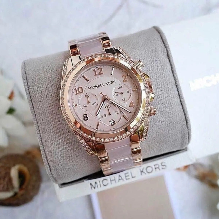 Front view of Michael Kors MK5943 women's rose gold watch with monochromatic dial