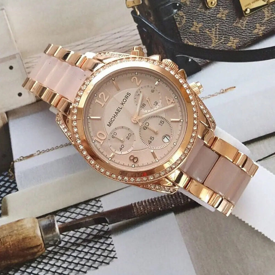 Front view of Michael Kors MK5943 women's rose gold watch with monochromatic dial