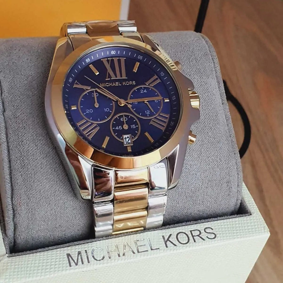 Front view of Michael Kors MK5976 with rich blue dial and gold-silver stainless steel strap