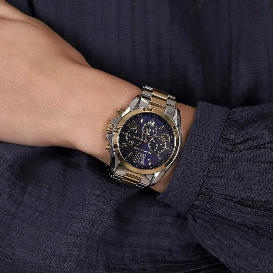 Front view of Michael Kors MK5976 with rich blue dial and gold-silver stainless steel strap
