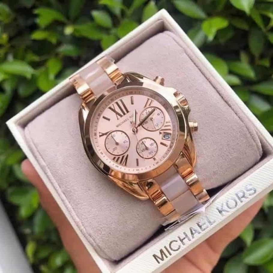 Front view of Michael Kors MK6066 women's rose gold-tone watch with sleek dial