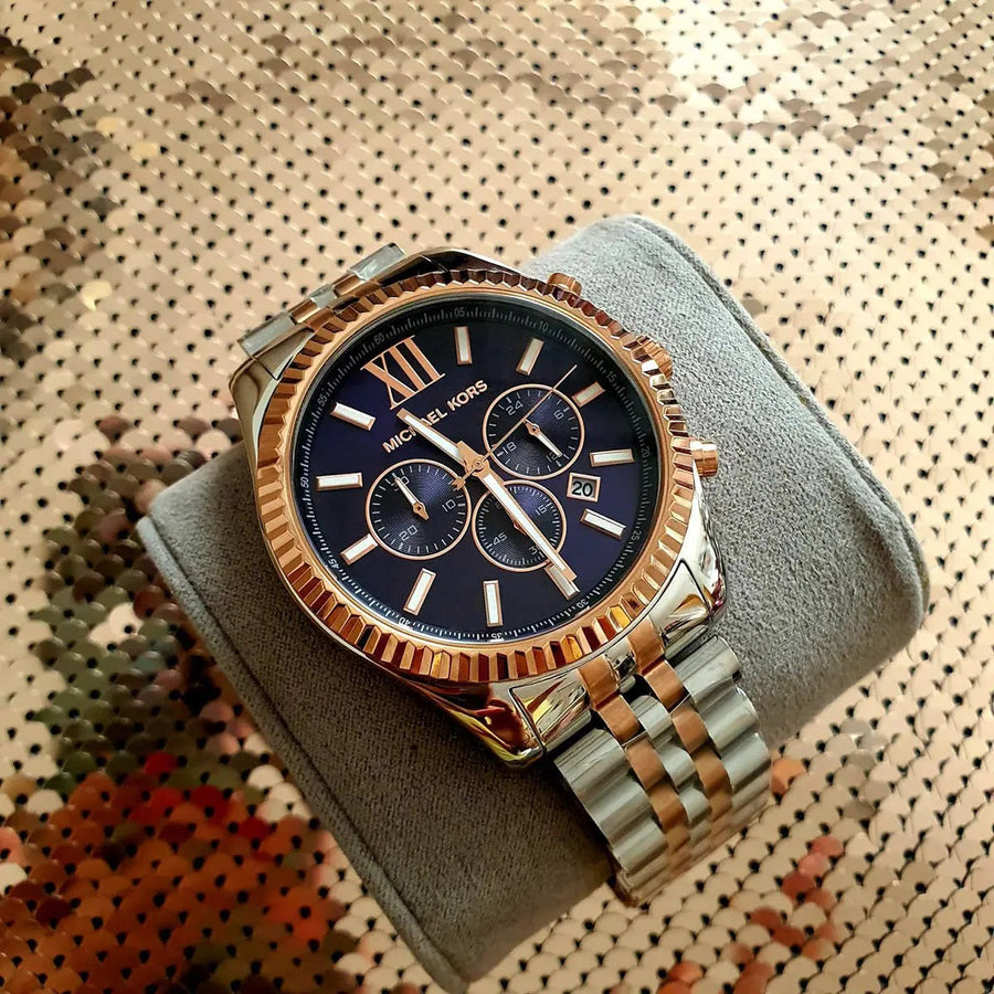 Front view of Michael Kors MK8412 men's watch with blue dial and two-tone silver-rose gold strap