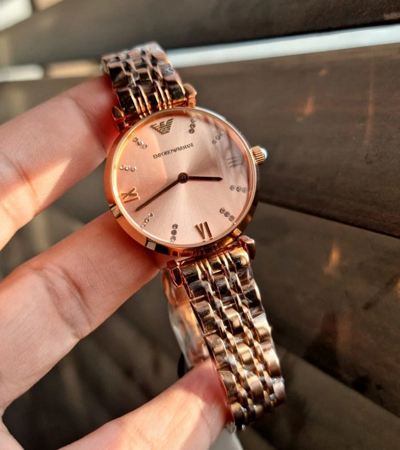 Front view of Emporio Armani AR11059 Gianni T-Bar women’s watch with gold dial and rose gold blush strap
