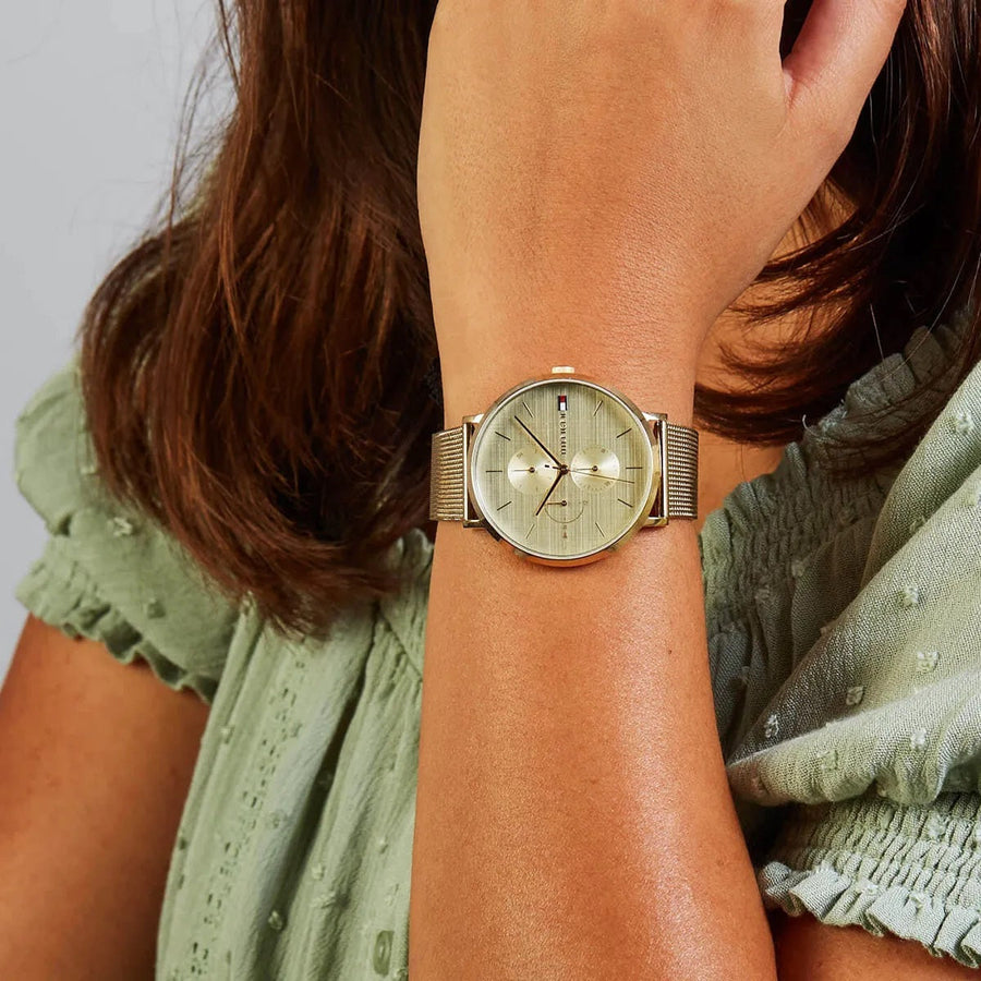 Front view of Tommy Hilfiger 1781943 women's watch with gold mesh strap and gold dial