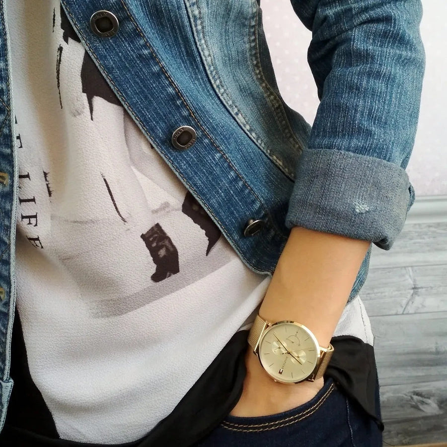 Front view of Tommy Hilfiger 1781943 women's watch with gold mesh strap and gold dial