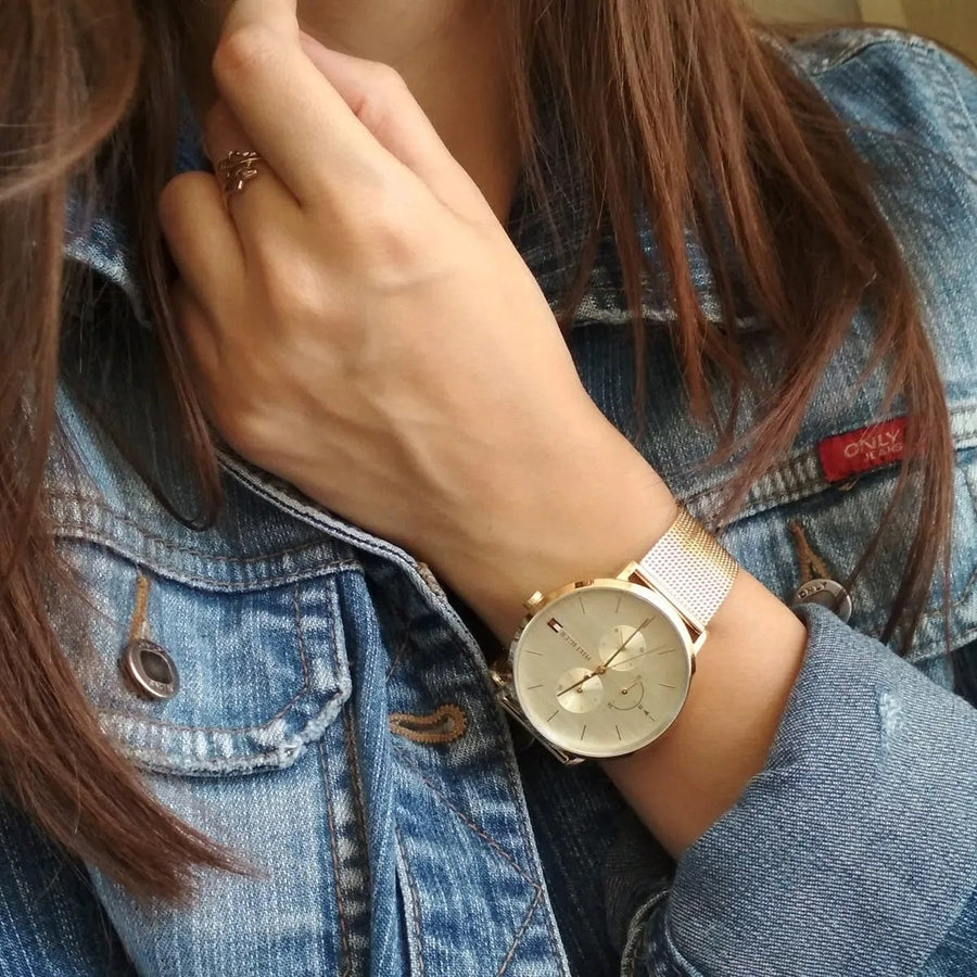 Front view of Tommy Hilfiger 1781943 women's watch with gold mesh strap and gold dial