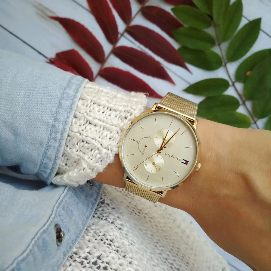 Front view of Tommy Hilfiger 1781943 women's watch with gold mesh strap and gold dial