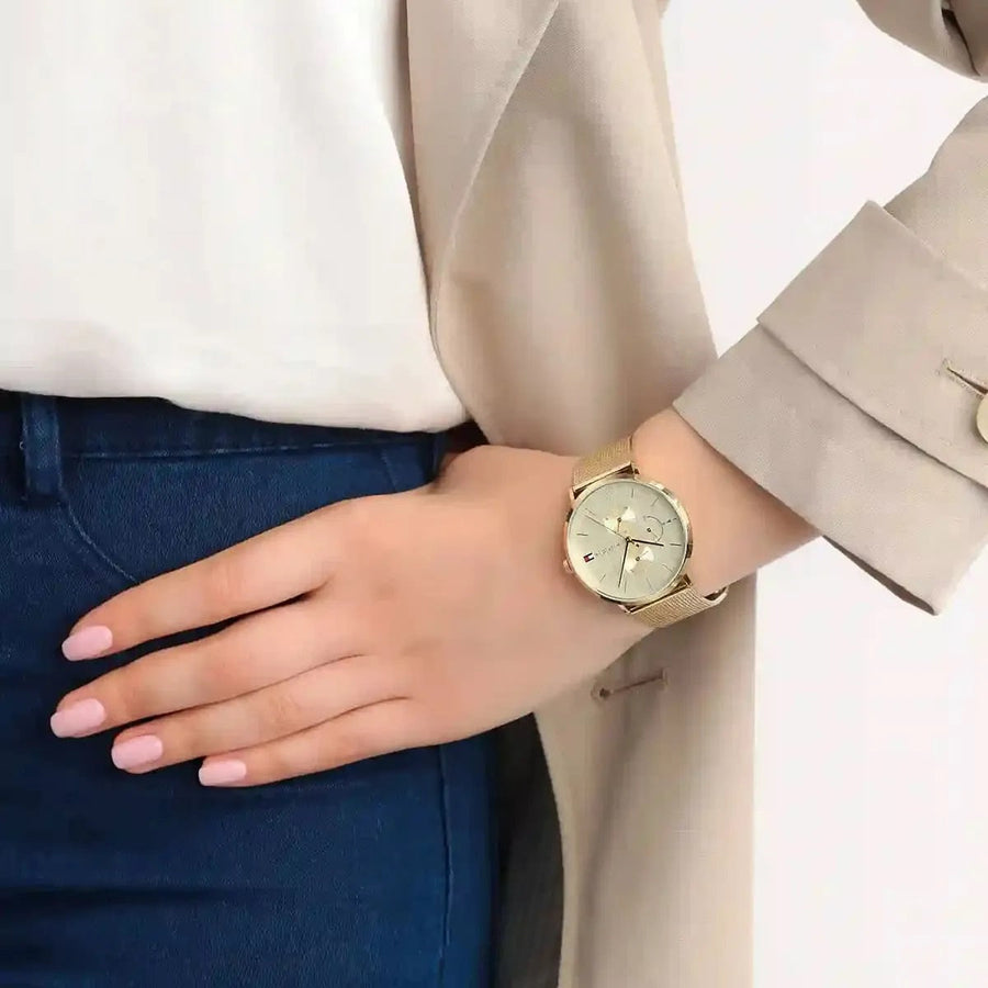 Front view of Tommy Hilfiger 1781943 women's watch with gold mesh strap and gold dial