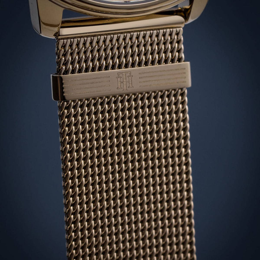 Front view of Tommy Hilfiger 1782302 women’s gold mesh strap watch with gold dial