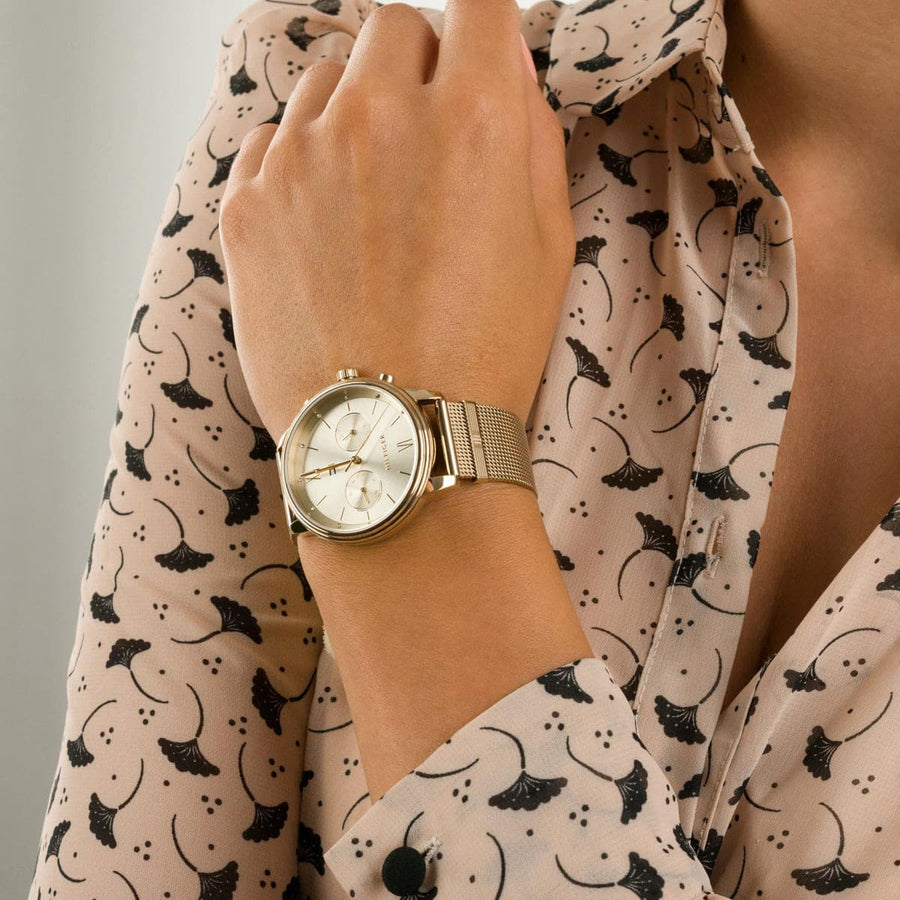 Front view of Tommy Hilfiger 1782302 women’s gold mesh strap watch with gold dial