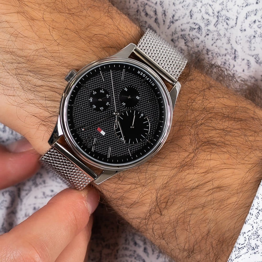 Close-up of black dial on Tommy Hilfiger 1791415 men's watch with minimalist design