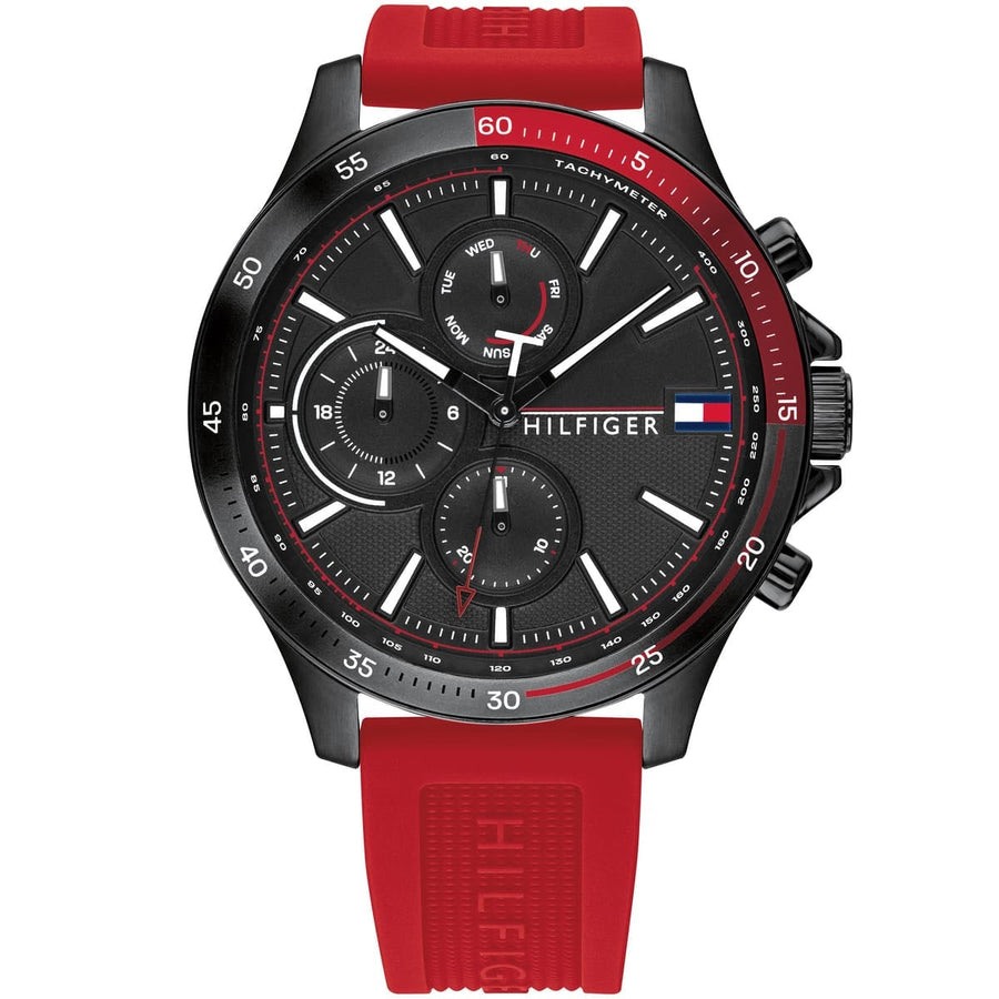 Close-up of Tommy Hilfiger 1791722 men’s watch featuring black dial, red silicone strap, and black case