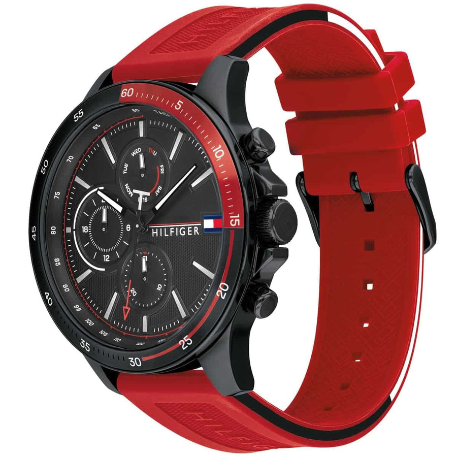 Close-up of Tommy Hilfiger 1791722 men’s watch featuring black dial, red silicone strap, and black case